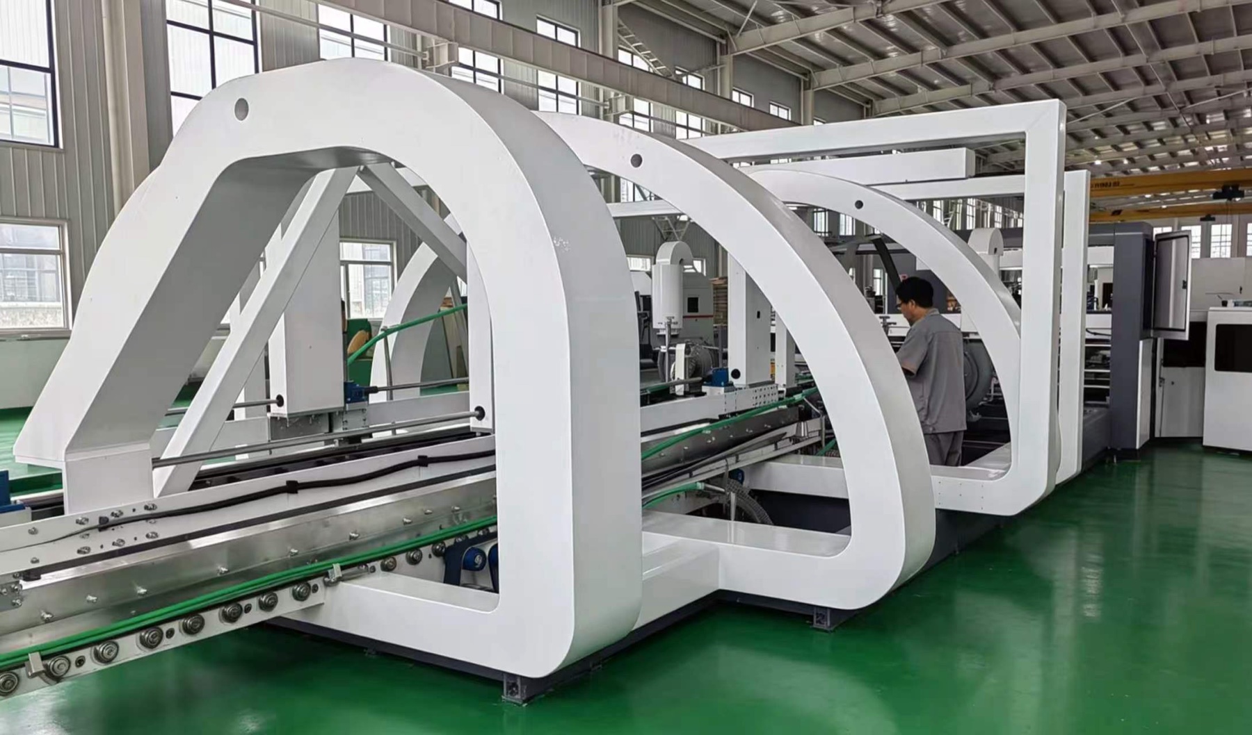 Automatic folder gluer stitcher line in workshop